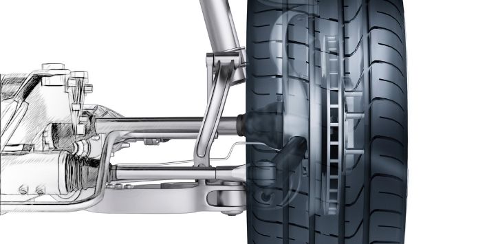 side view of automotive suspension and wheel on a white background